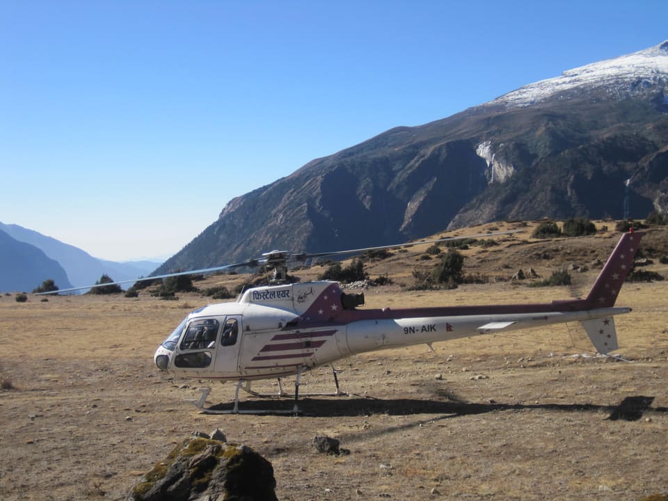 Helicopter landed in a high, dry valley
